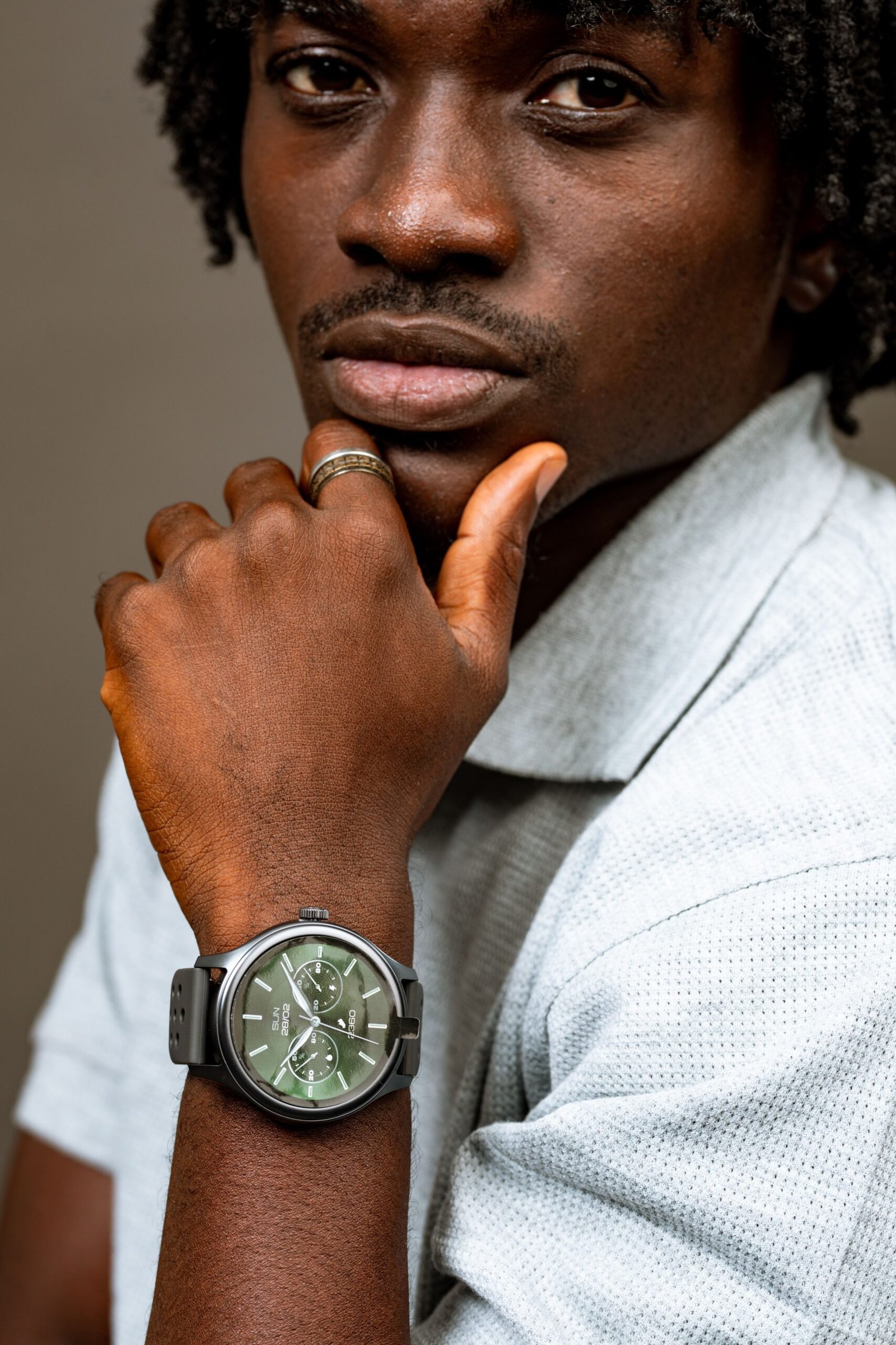 Close-up portrait of a man wearing a stylish wristwatch in Accra, Ghana.